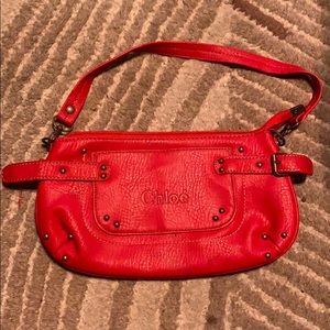 Small Chloé brand clutch. Leather w/ suede inside